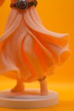3D-printed PLA statue of the Diva of Moroccan Andalusian music, wearing traditional flowing dress and jewelry, with graceful dancing posture.