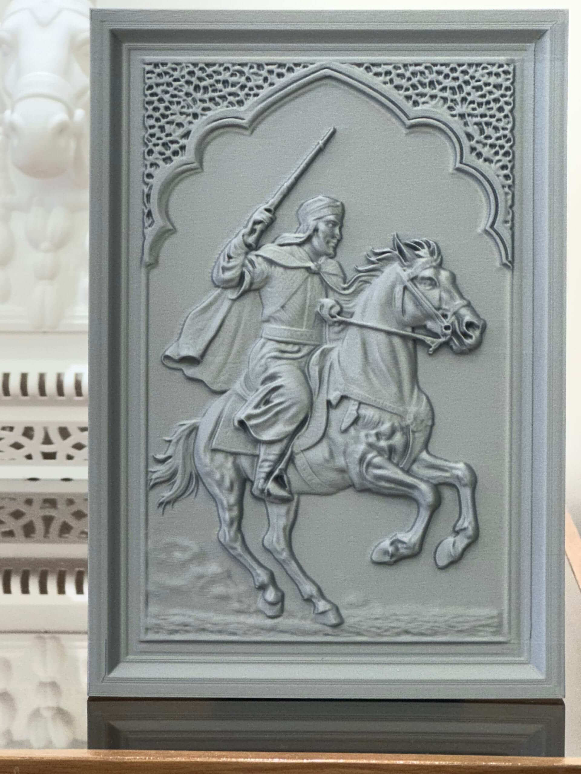 Fantasia Horseman Relief Sculpture (25 x 15 cm) 3D-printed Fantasia Horseman Relief Sculpture featuring Moroccan rider on galloping horse framed in Moorish arch with decorative mashrabiya pattern.